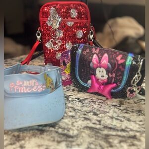 Disney Bundle includes two crossbody bags, visor and three bag charms